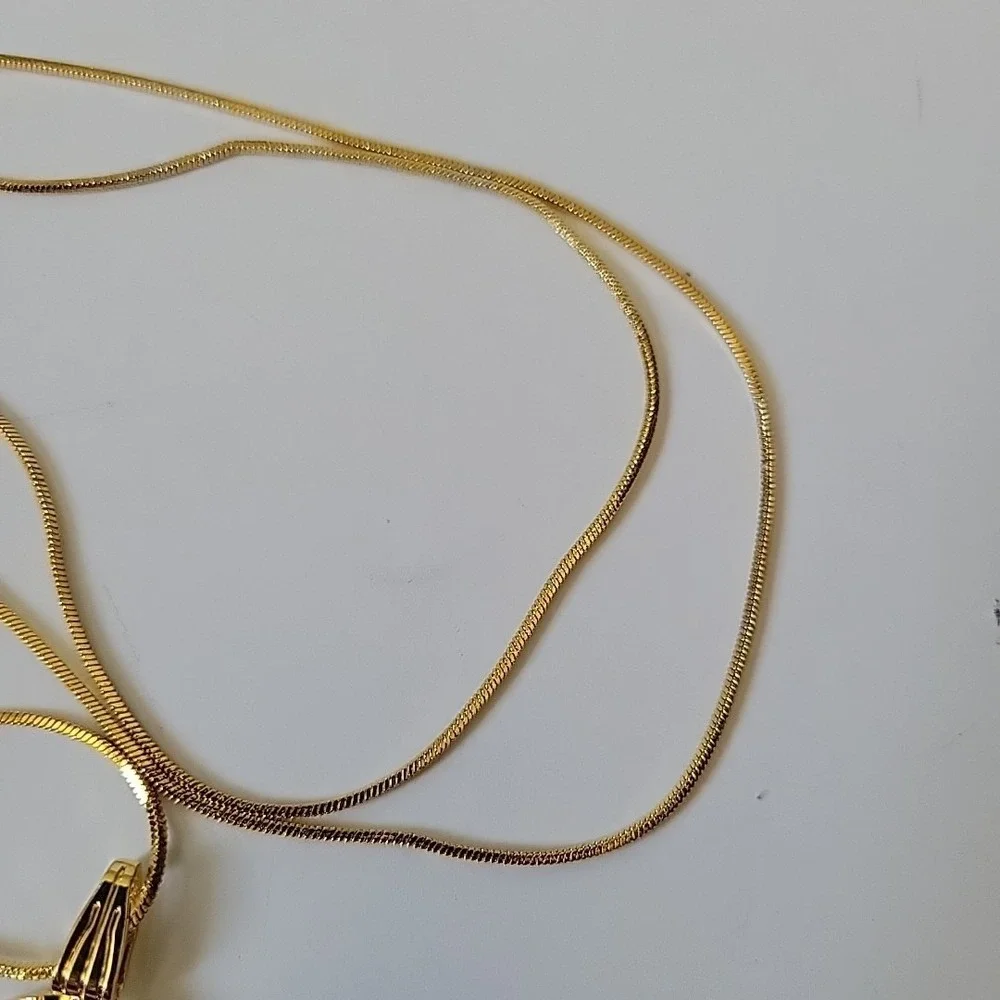 Neckglasses features gold